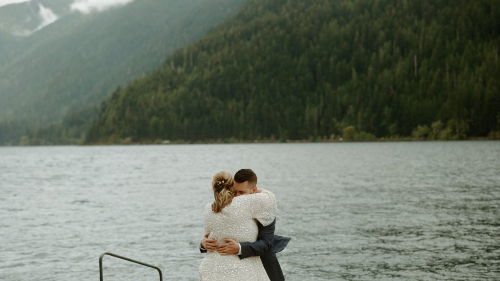 First look in front of lake in Oregon taken by Oregon Wedding Videographer, Alesia Films