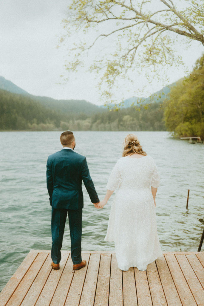 Eloped couple in front of lake in Oregon