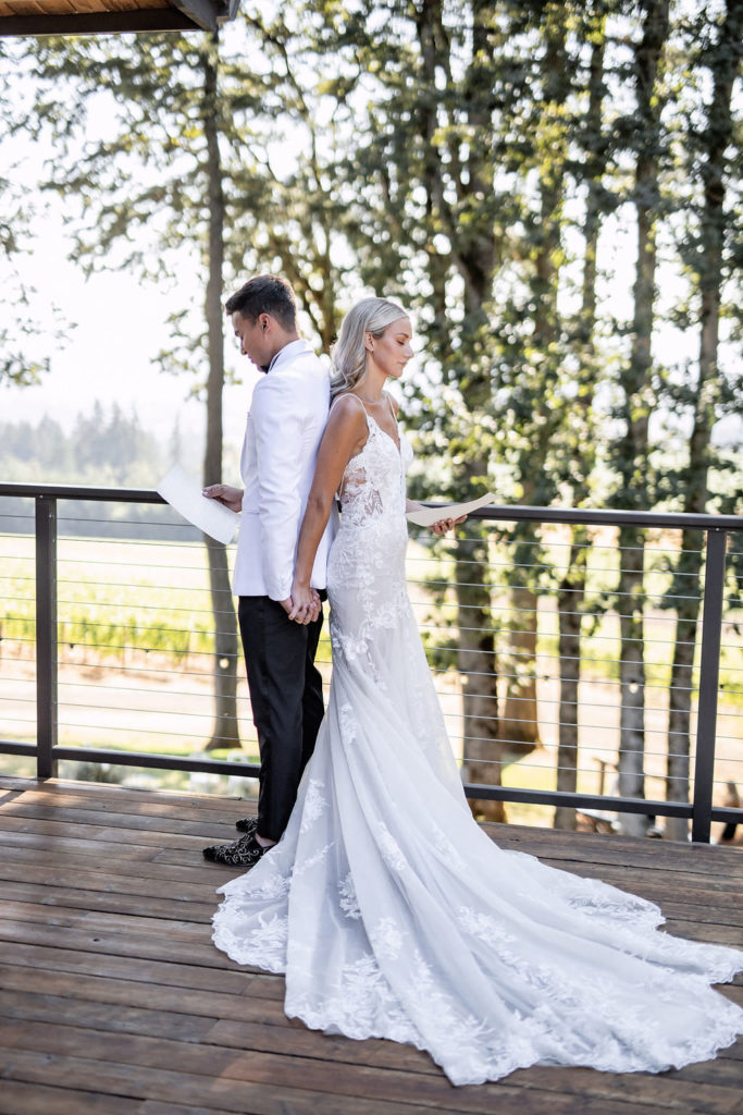 private vows exchange bride and groom at winery summer elopement