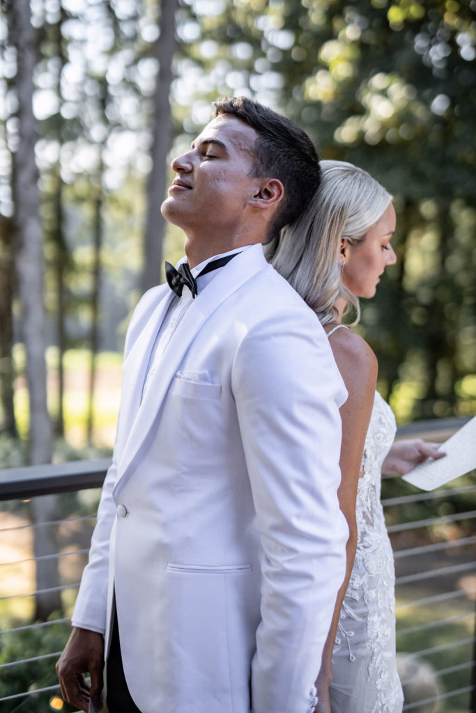 Portrait of bride and groom private vow exchange with eyes closed at winery summer elopement