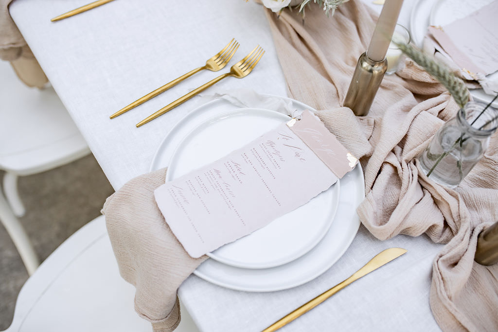 plates, silverware, and dinner menu at oregon winery elopement