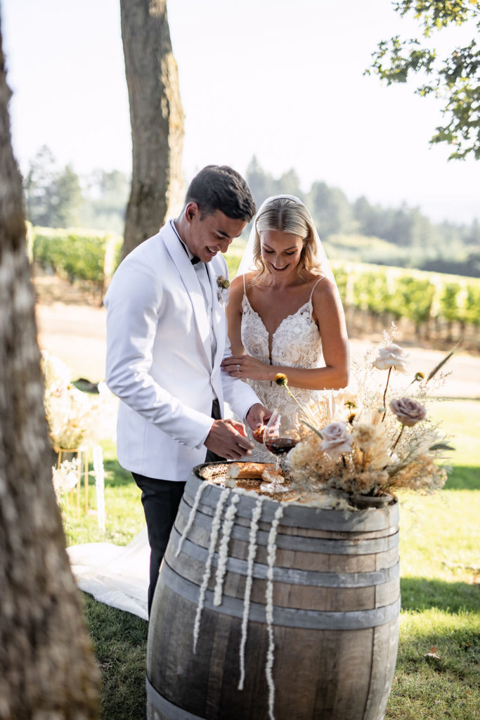 Bride and groom wine tasting at Domaine de Broglie winery summer elopement in Dayton, Oregon