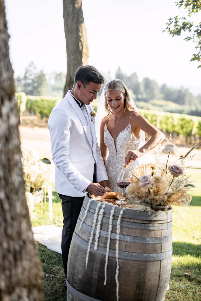 Bride and groom wine tasting at Domaine de Broglie winery summer elopement in Dayton, Oregon