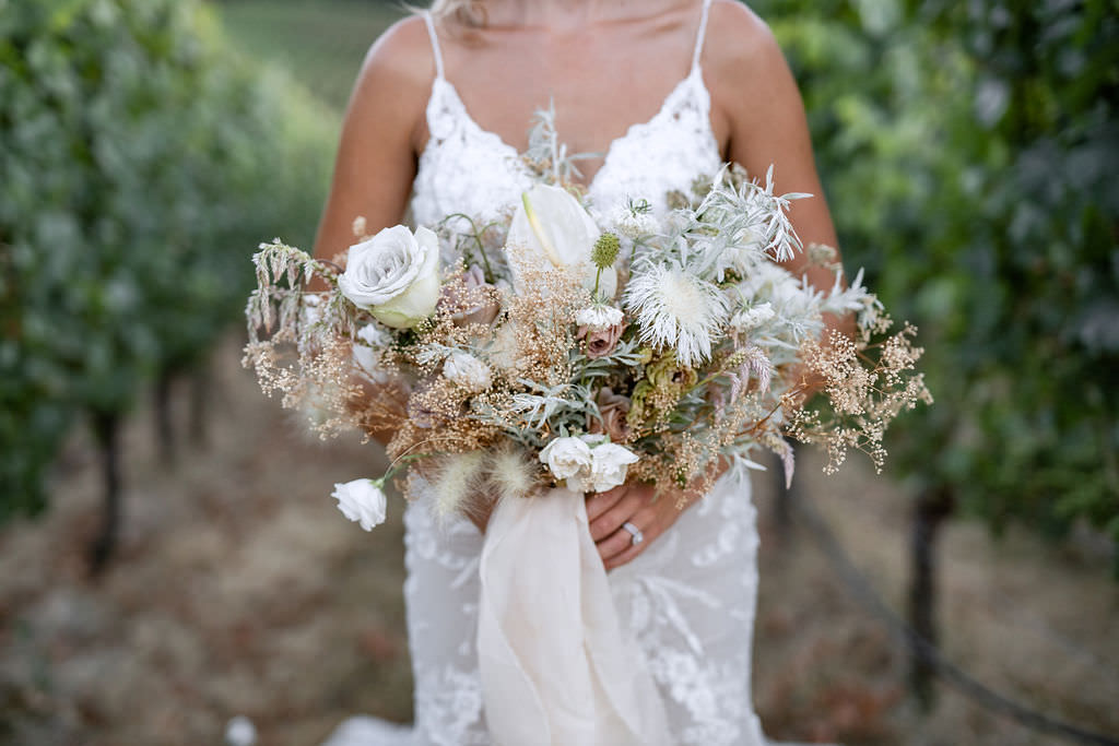 Bride's wedding floral bouquet at Domaine de Broglie winery summer elopement in Dayton, Oregon