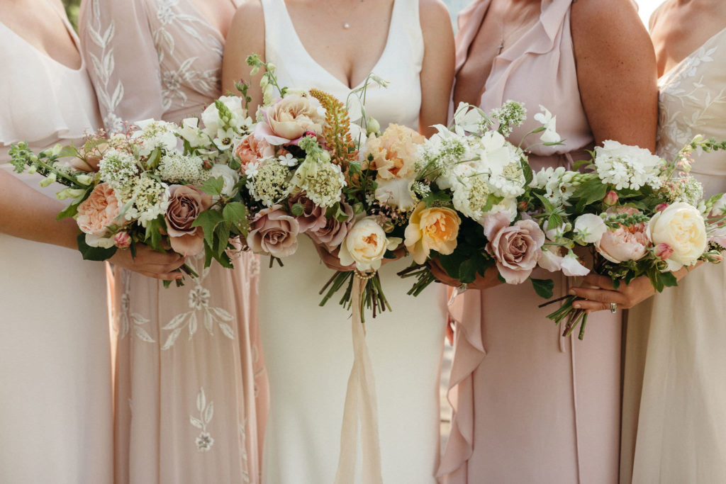bridal party holding bouquets