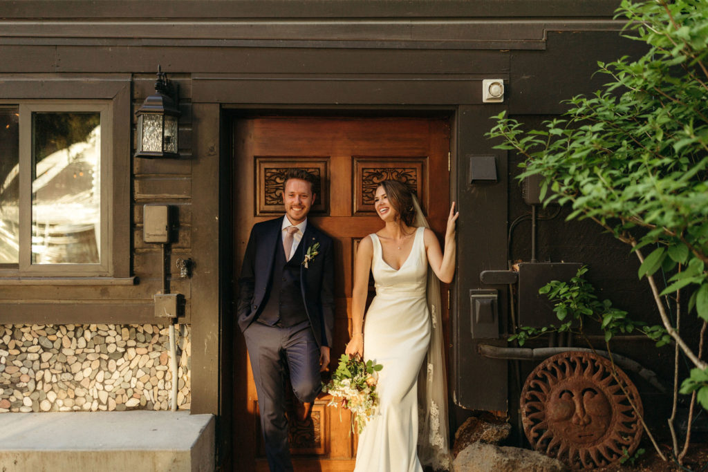 couple standing in front of door
