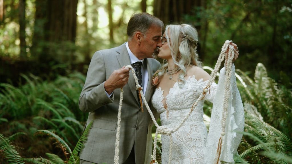 bride and groom holding rope macrame