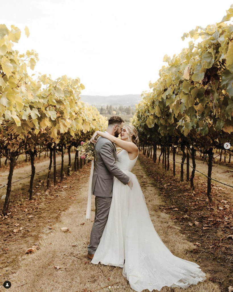scholls valley lodge wedding couple in vineyard