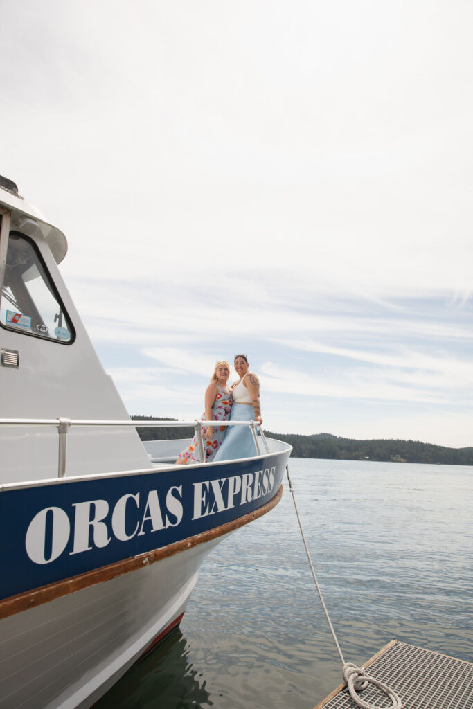 Bride posing on bow of boat during Orcas Island whale-watching tour