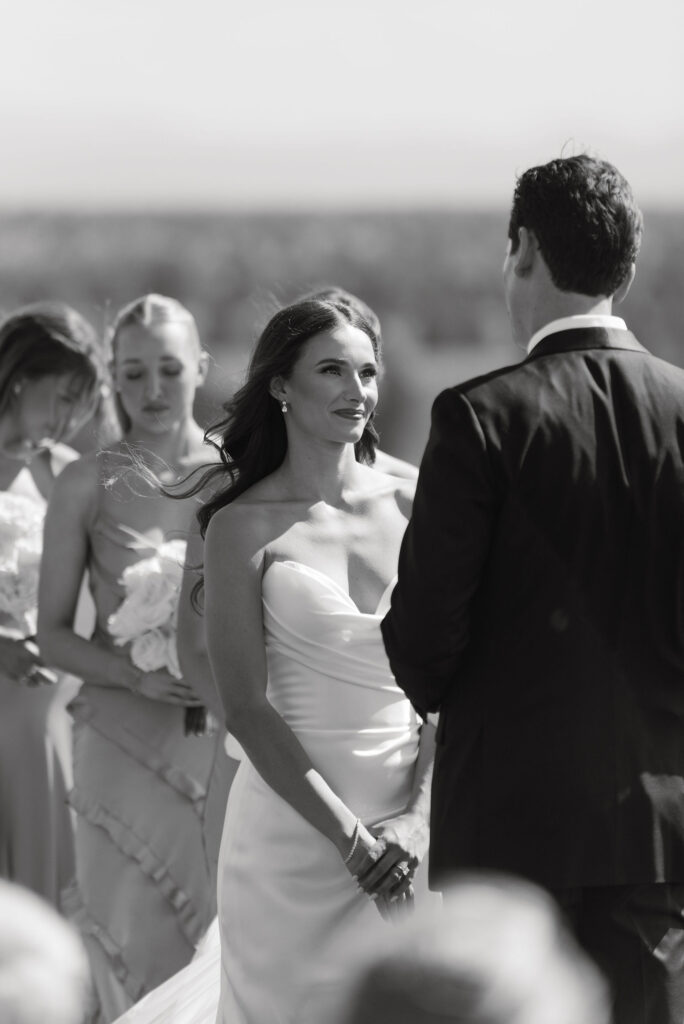 Bride staring into groom's eyes during Brasada Ranch wedding ceremony