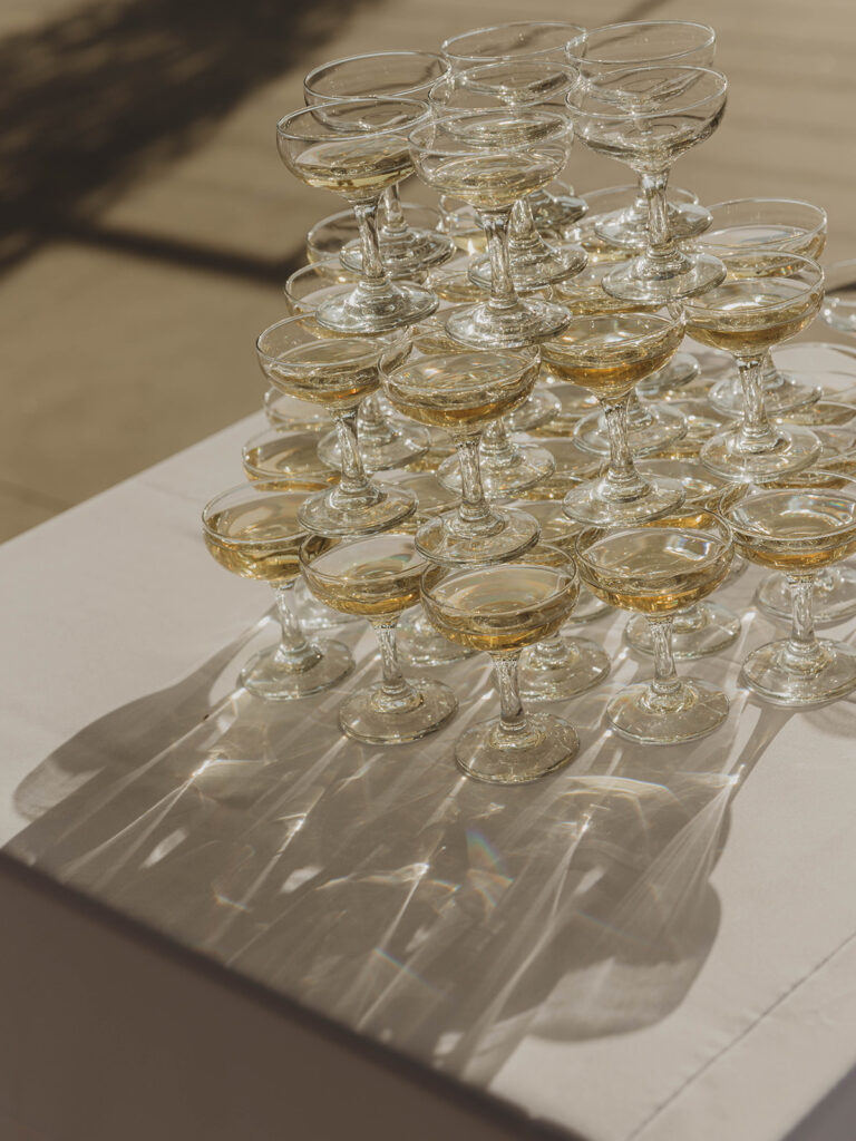 Artistic shot of filled champagne tower at Callaway Vineyard & Winery wedding cocktail hour