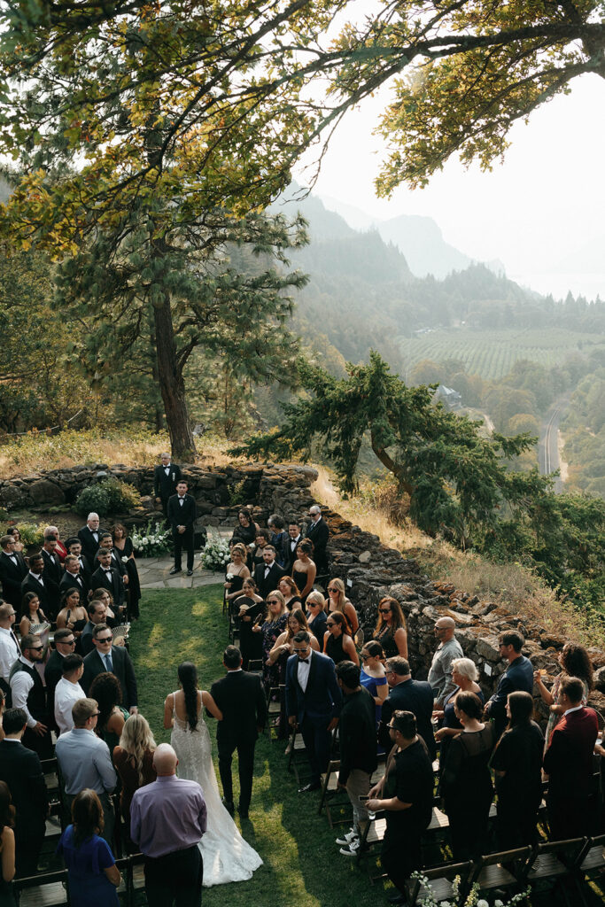 Bride walking down the aisle at romantic Griffin House wedding as seen from above