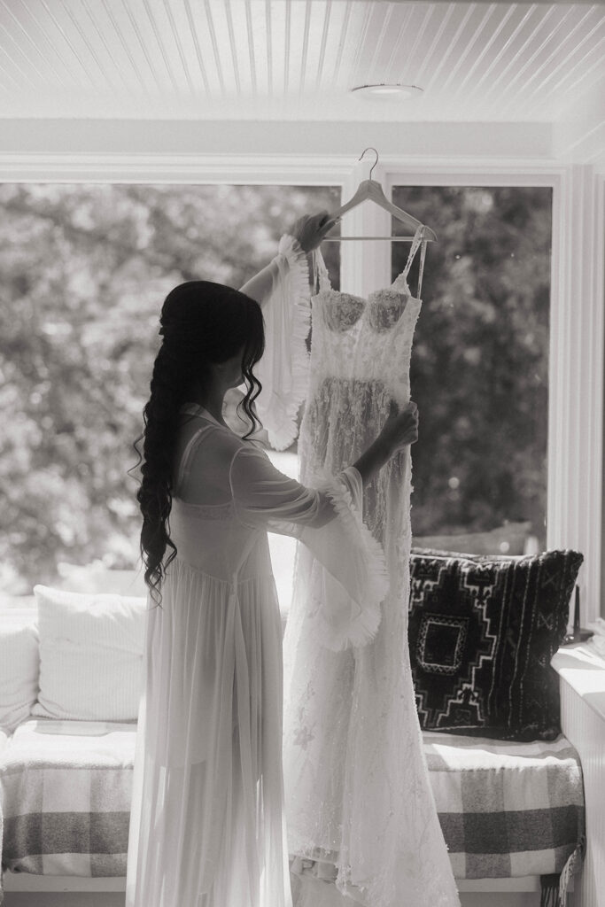 Getting ready shot of bride with gown hanging up