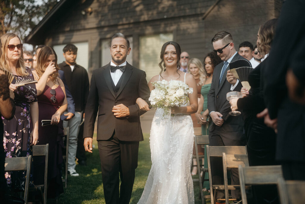 Bride coming down the aisle at Hood River wedding ceremony