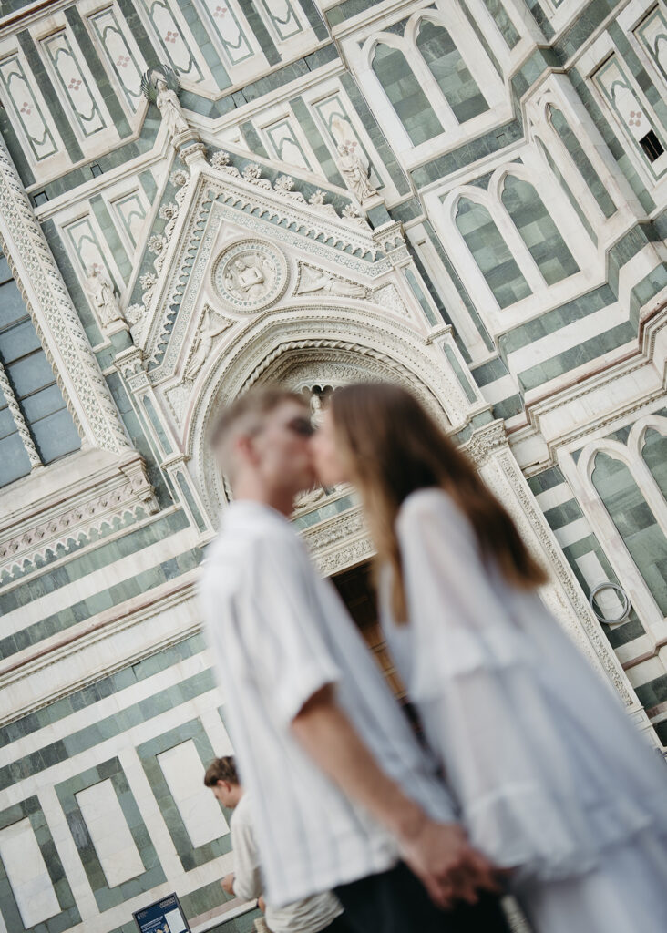 Pre-wedding couple portrait in front of the Duomo in Florence, Italy