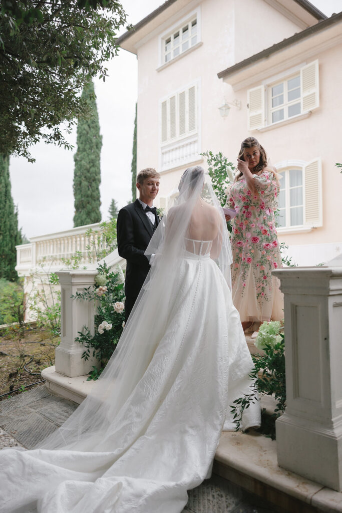 Villa Rinaldi wedding ceremony on floral-laden staircase