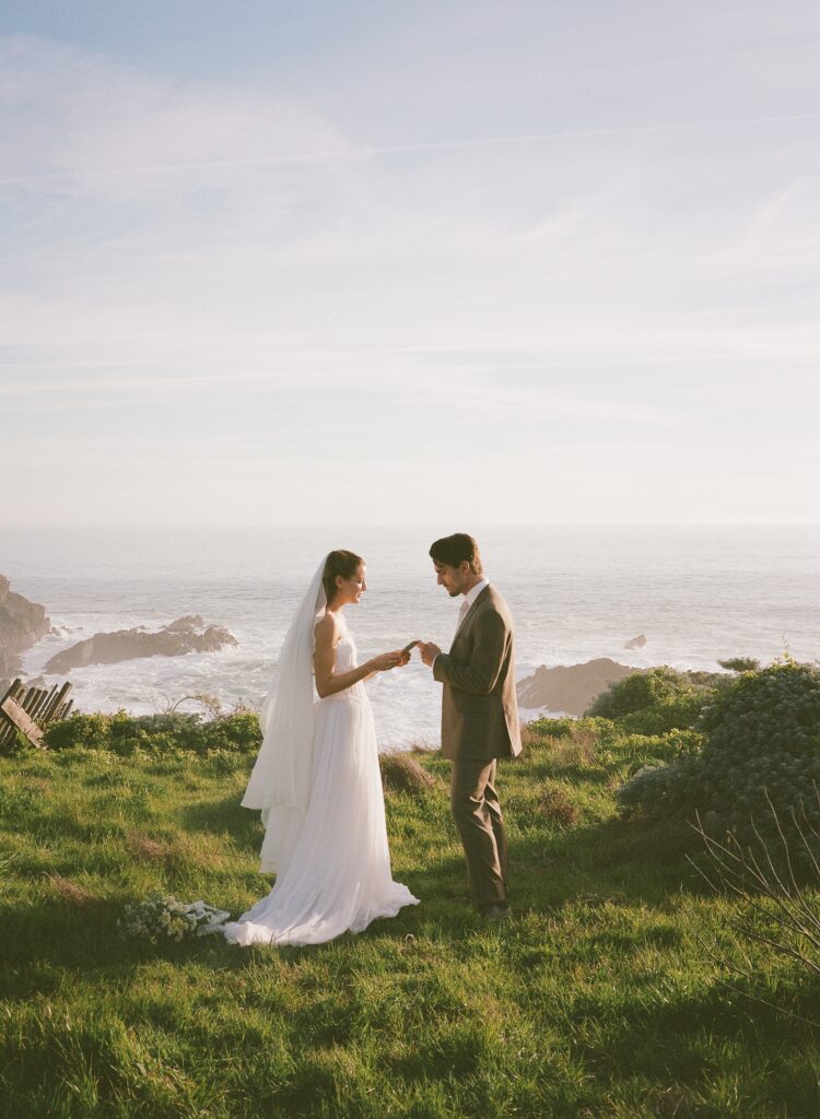 Elopement couple exchanging vows on the coast during Sea Ranch Lodge wedding.