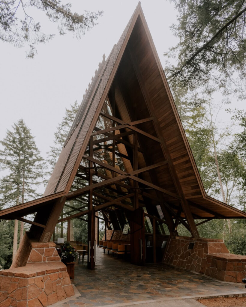 Capella by the Sea, one of the most unique Oregon Coast wedding venues, featuring a dramatic A-frame chapel nestled in the trees.